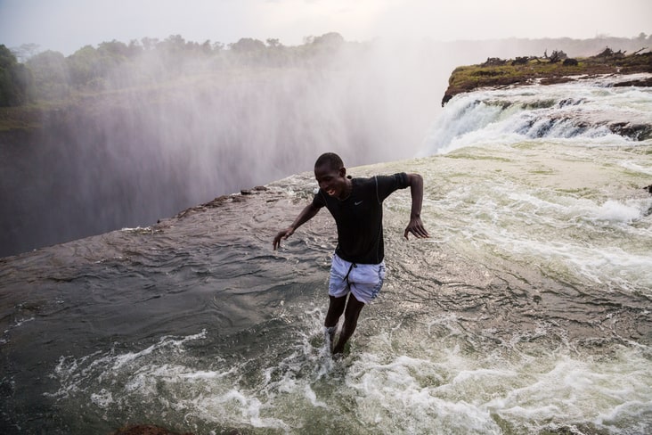 A man jumps into the Devil's Pool