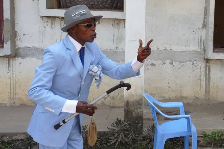 A Brazzaville sapeur in a blue suit and hat