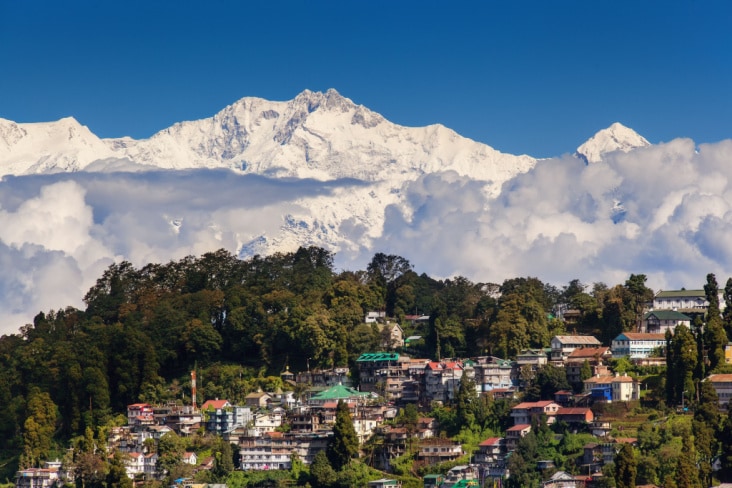 Kangchenjunga rising above a village in Darjeeling 