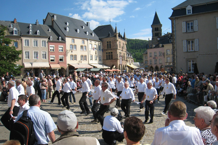 Crowds gather for the dancing procession