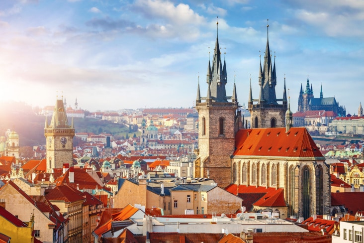 A photo of Prague showing several spires