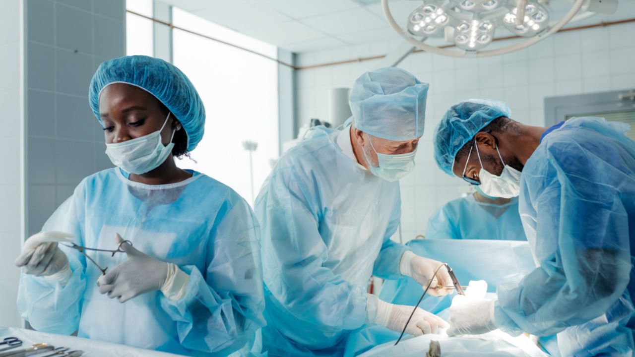 Doctors performing organ transplant.
