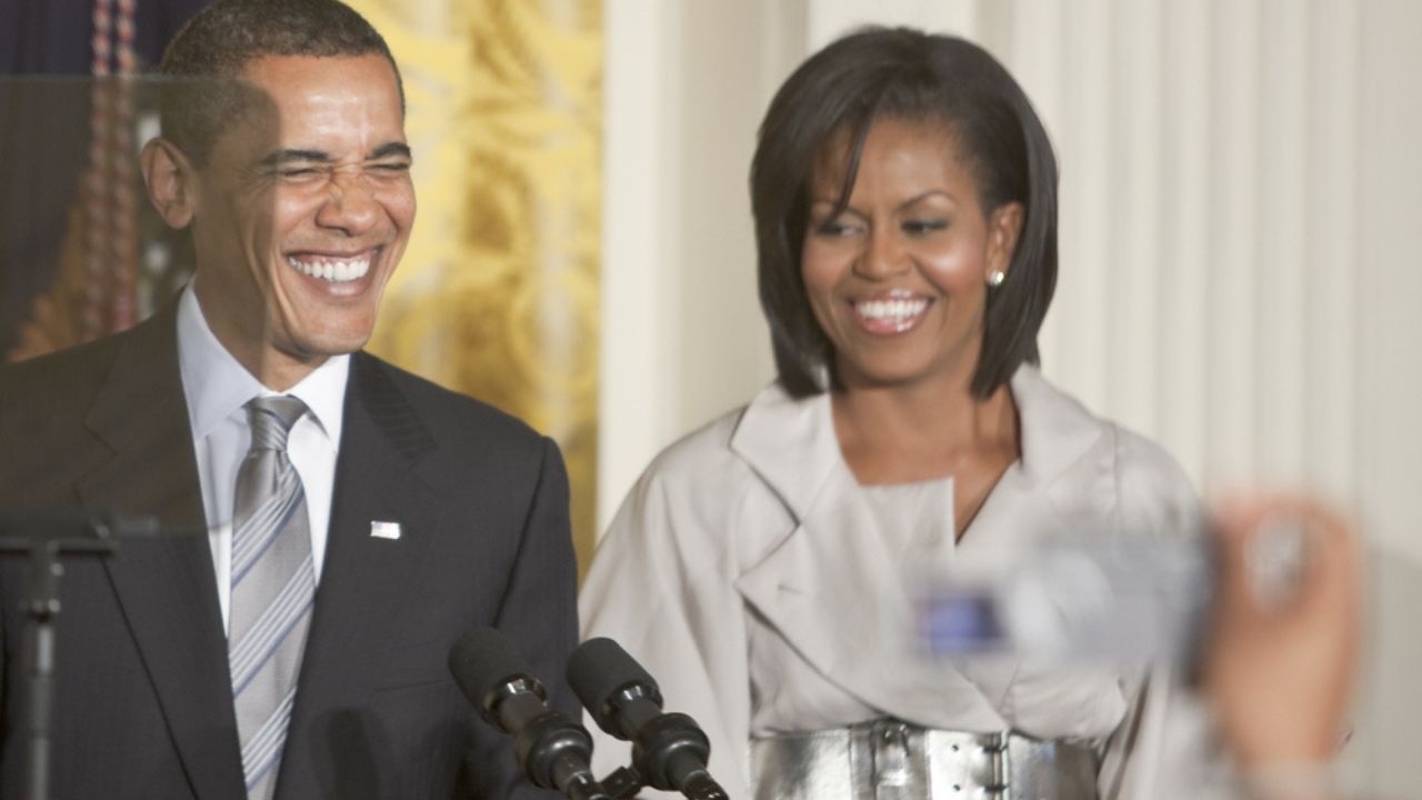 Barack Obama with the first lady Michelle Obama next to him gives speech from the East Room of the White House.