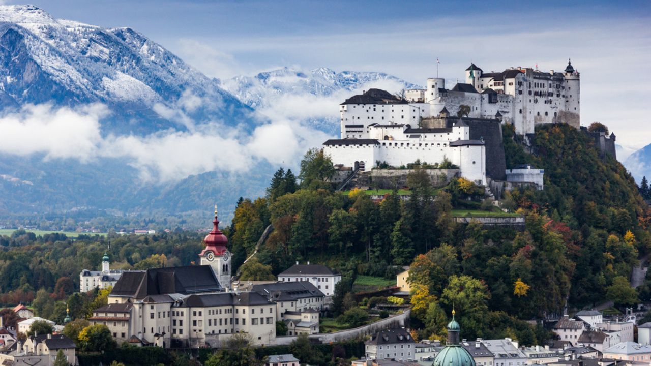 Salzburg skyline with Festung Hohensalzburg and Salzach river in summer