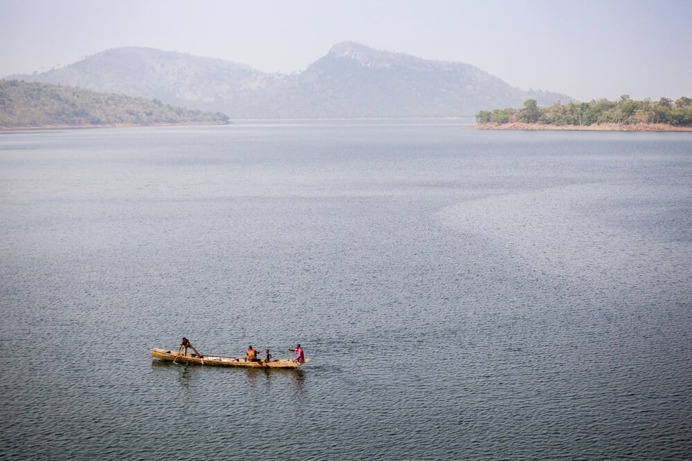 Traditional Boats with fishermen on Tropical Volta Lake in Ghana